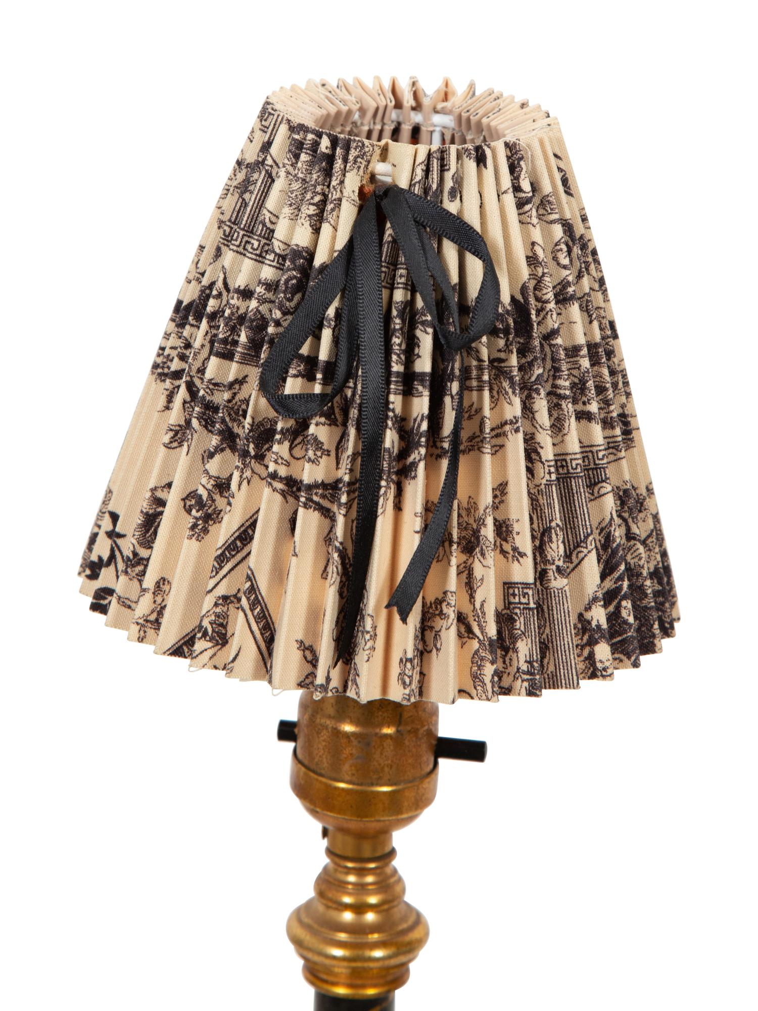 A Pair of Gilt and Black-Painted Metal Candlesticks Mounted as Lamps