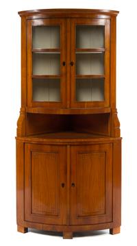 A Biedermeier Fruitwood Corner Cabinet Height 81 x depth 25 inches.