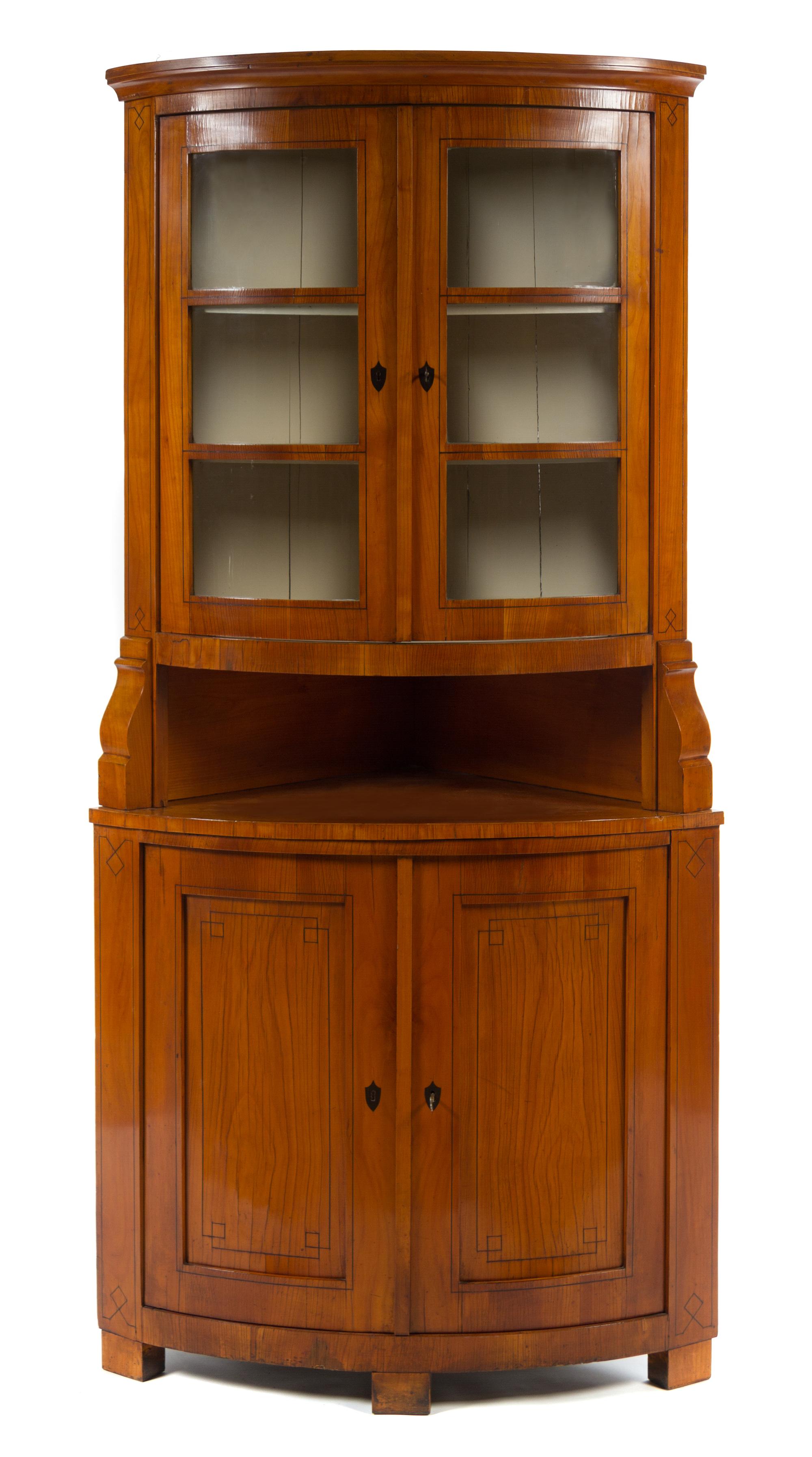 A Biedermeier Fruitwood Corner Cabinet Height 81 x depth 25 inches.