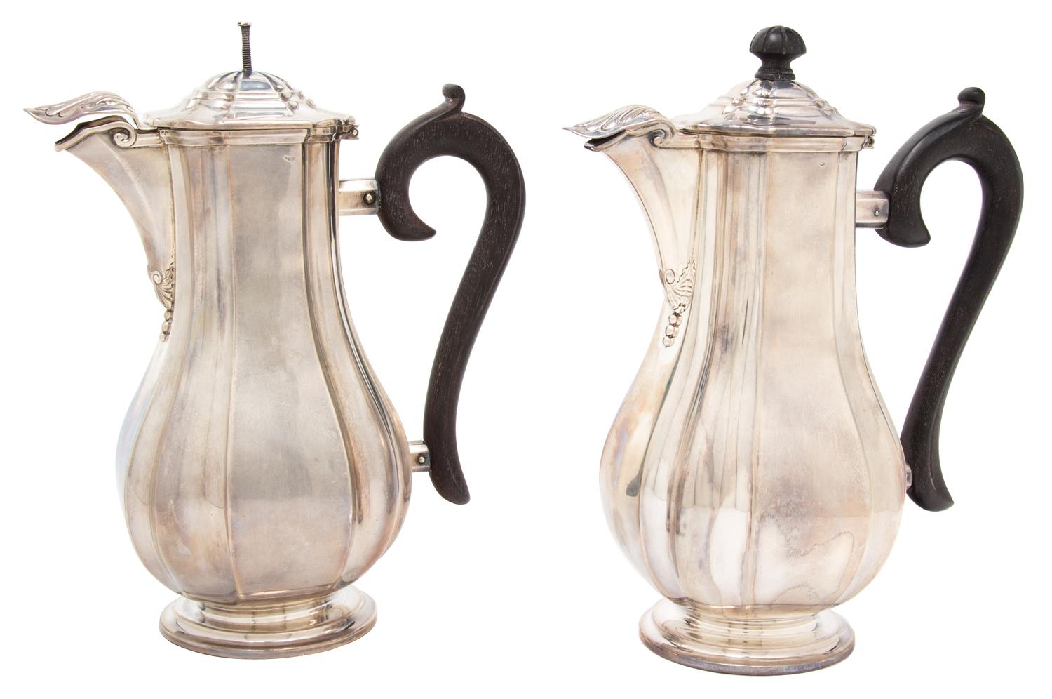 A Pair of French Silver Coffee Pots, Auguste Leroy & Cie., Paris, 1912-1935, having ebonized treen handles and finials, hinged spout co