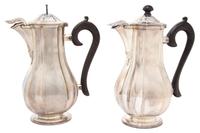 A Pair of French Silver Coffee Pots, Auguste Leroy & Cie., Paris, 1912-1935, having ebonized treen handles and finials, hinged spout co