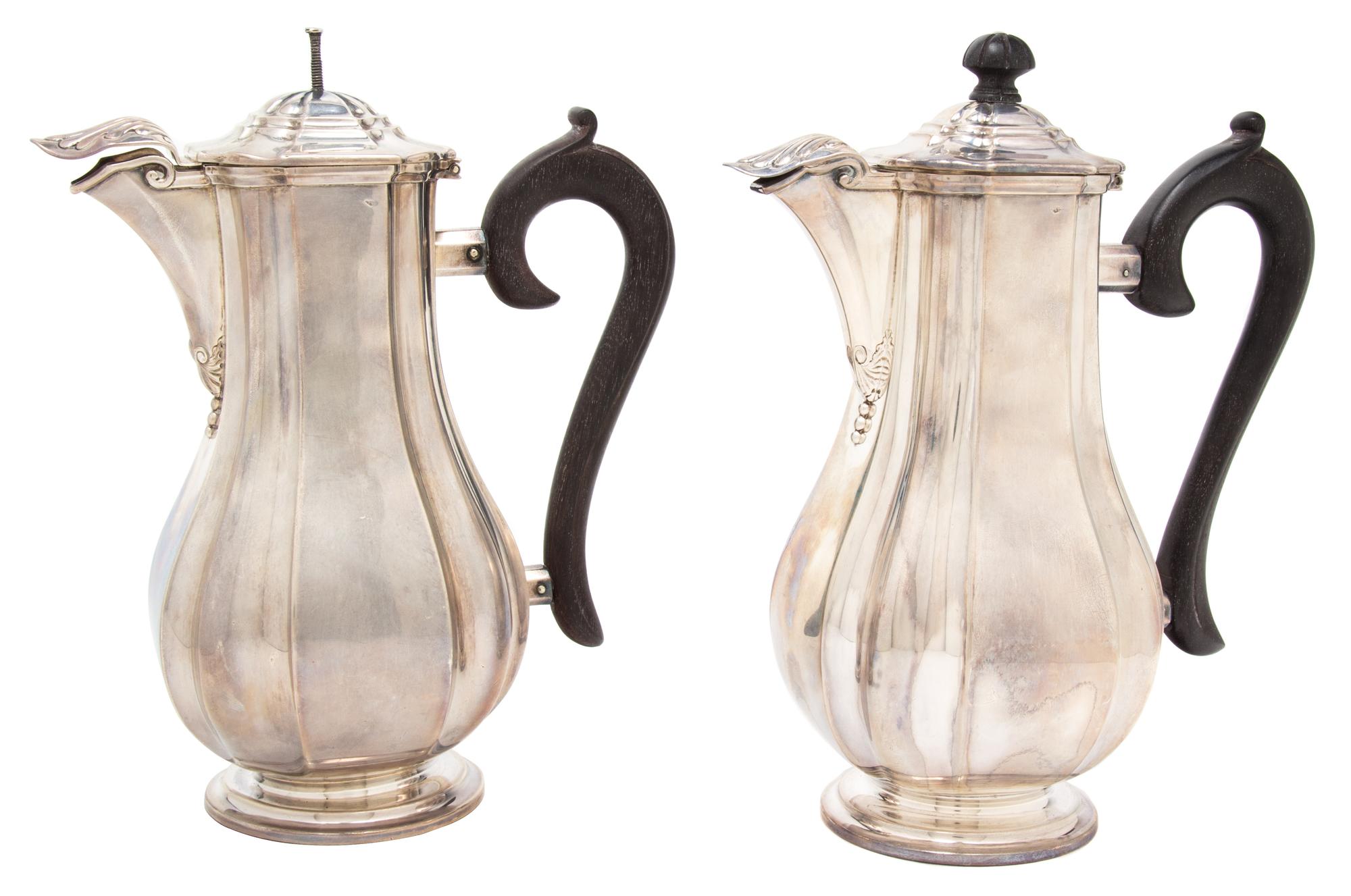 A Pair of French Silver Coffee Pots, Auguste Leroy & Cie., Paris, 1912-1935, having ebonized treen handles and finials, hinged spout co