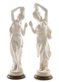 A Pair of Italian Marble Figures Height of tallest 42 1/4 inches. — 20TH CENTURY