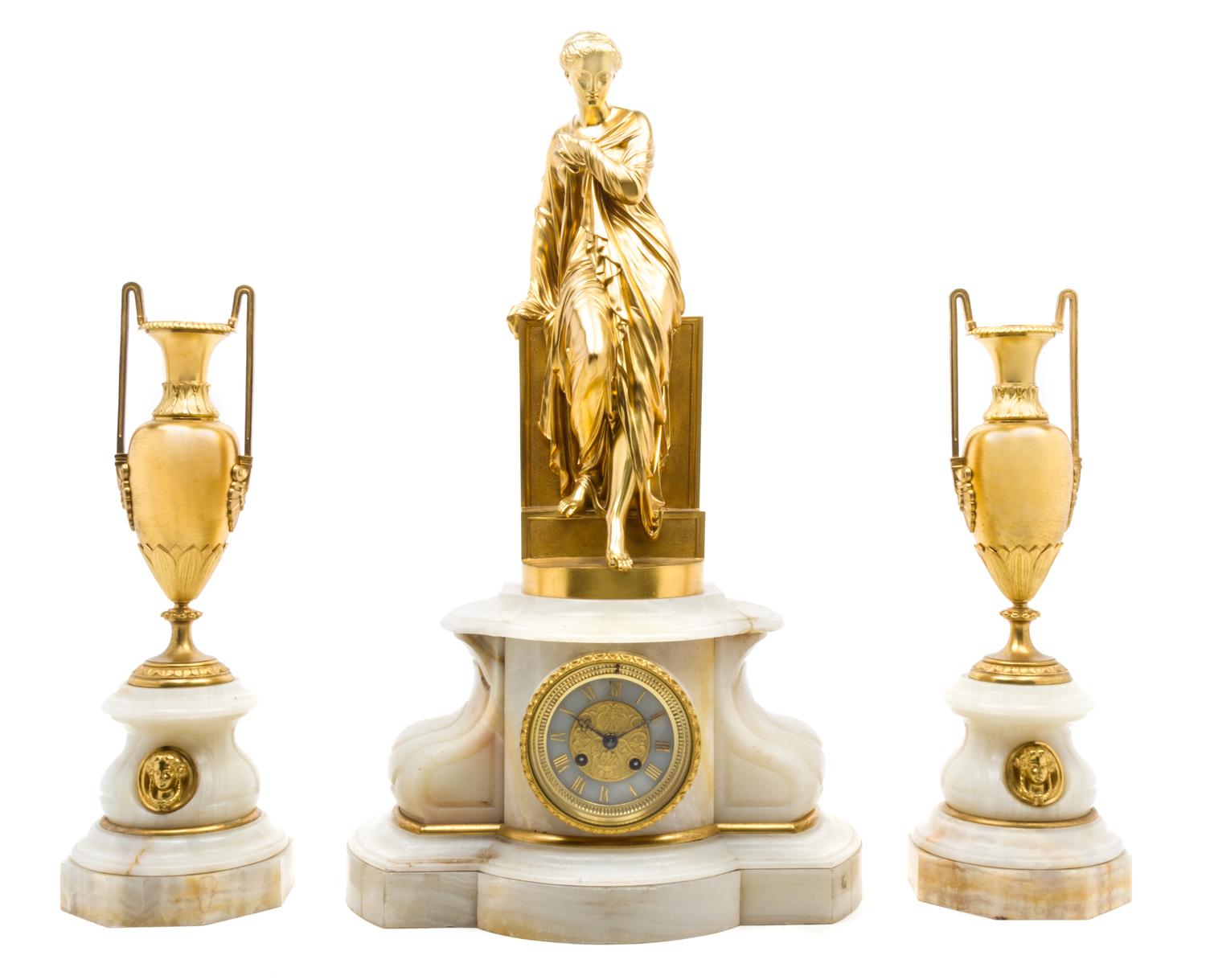 A French Gilt Bronze Mounted Onyx Clock Garniture Height of clock 25 inches.