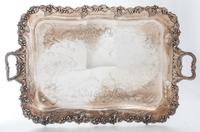 A Group of Silver-Plate Serving Trays Width of widest over handles 30 inches.