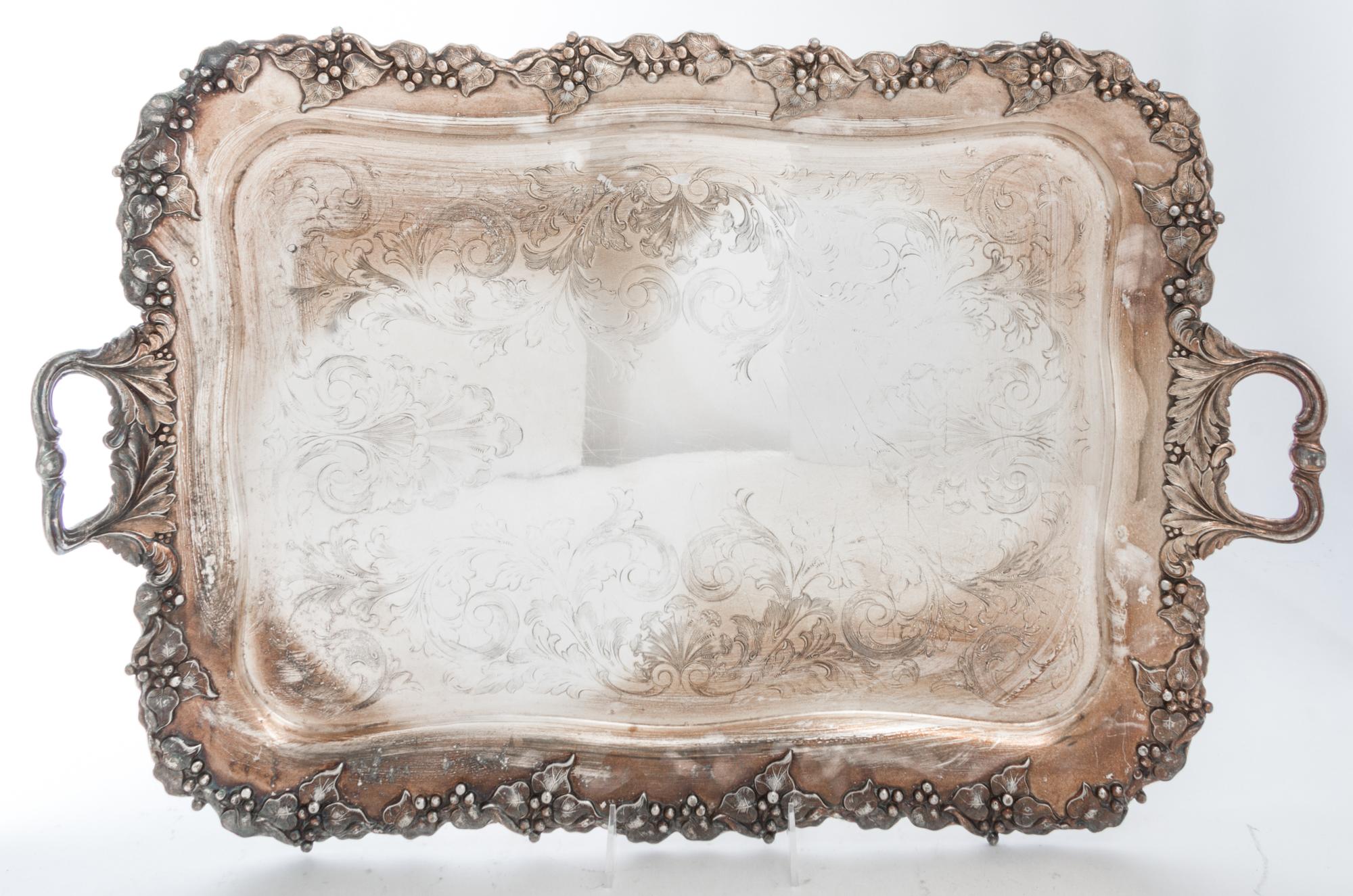 A Group of Silver-Plate Serving Trays Width of widest over handles 30 inches.