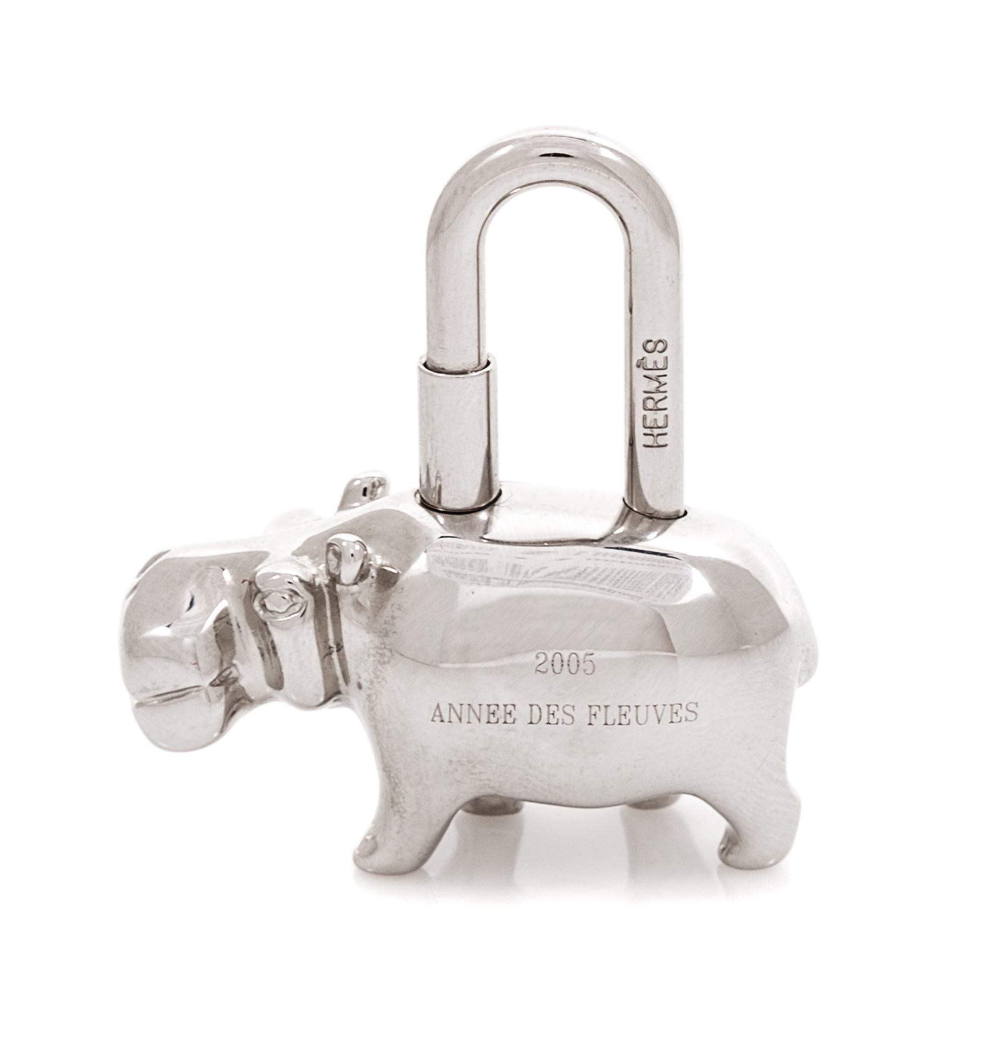 An Hermès Palladium Plated Hippopotamus Cadena Lock Charm, 1.5" L x 1.4" W.