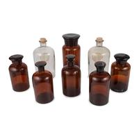 Eight Amber and Colorless Glass Apothecary Jars