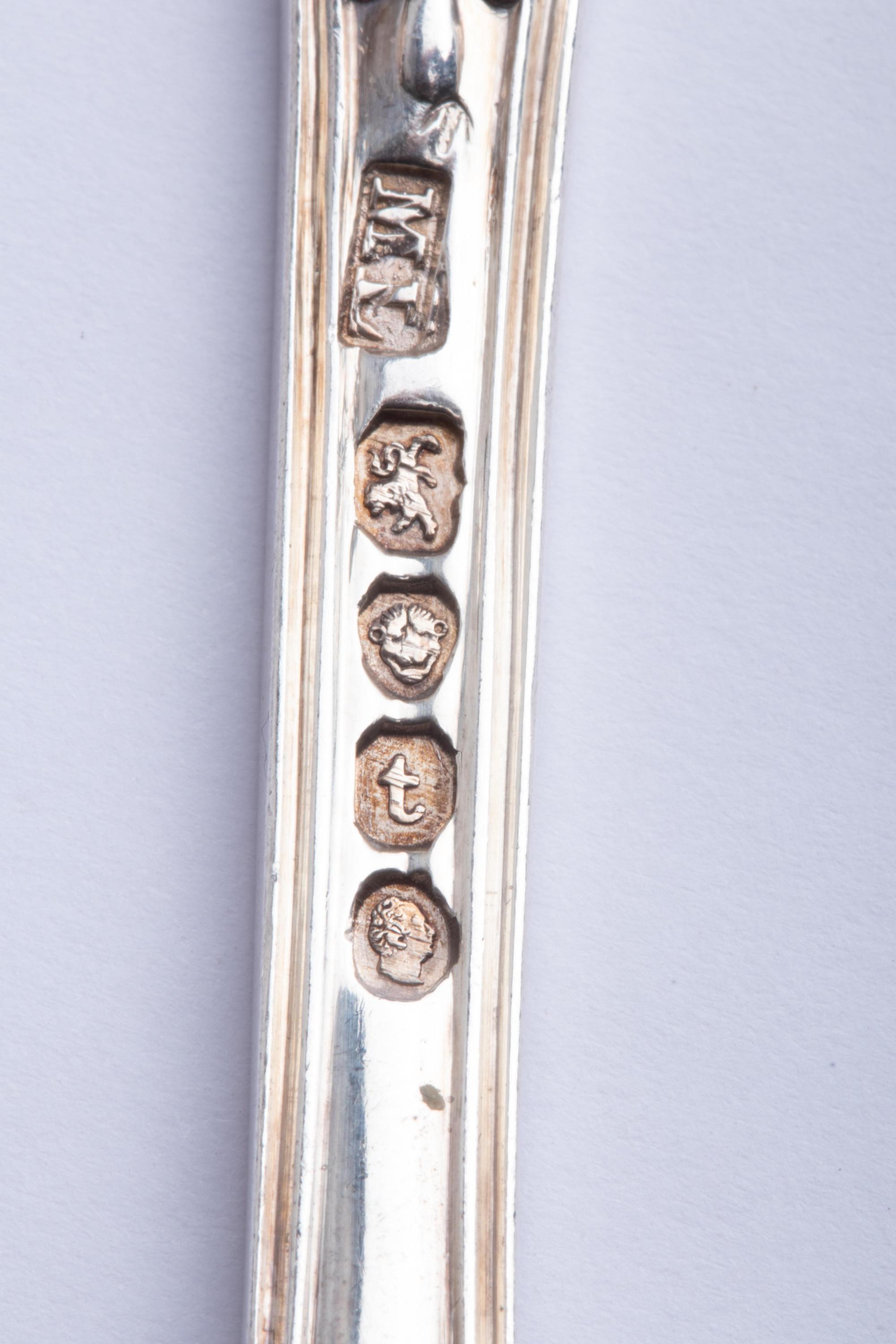 A Group of Twelve English Silver Soup Spoons