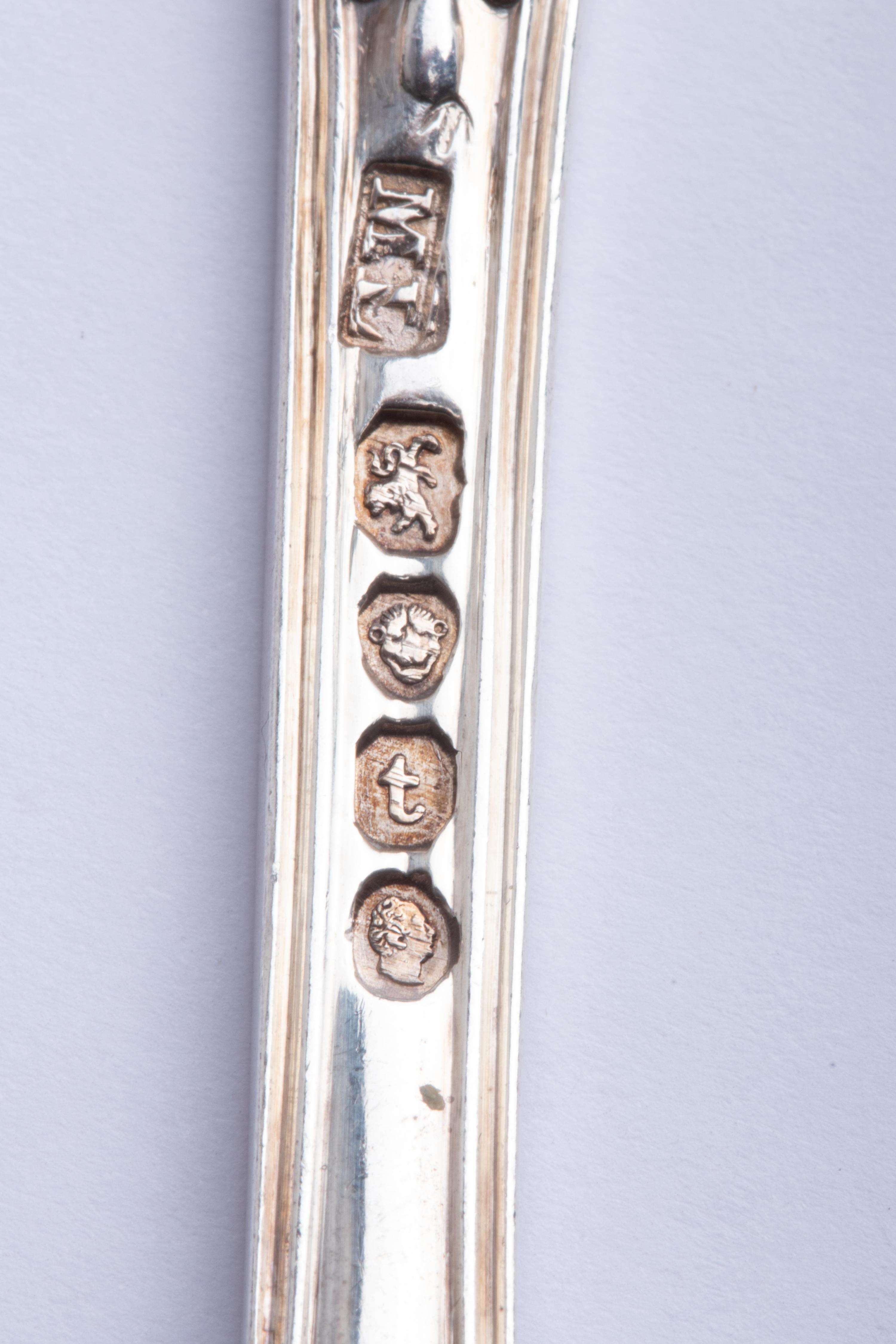 A Group of Twelve English Silver Soup Spoons