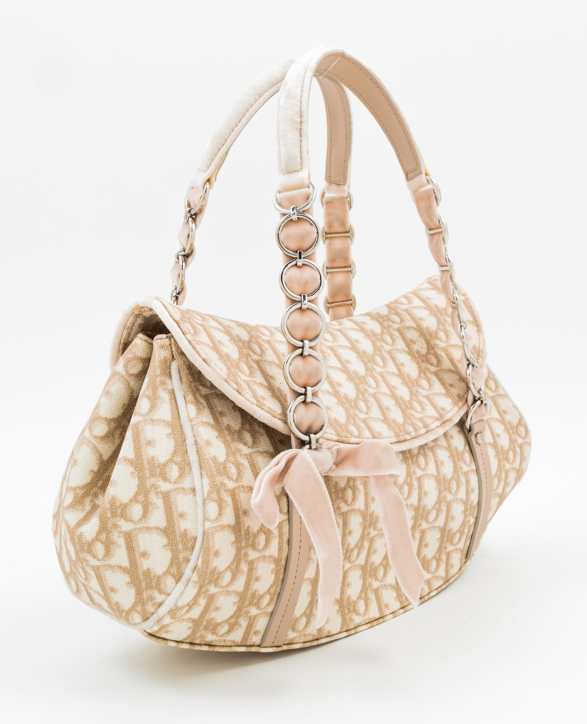 A Christian Dior Monogram Romantique Trotter Bag, 12" x 7" x 4"; Handle drop: 6".