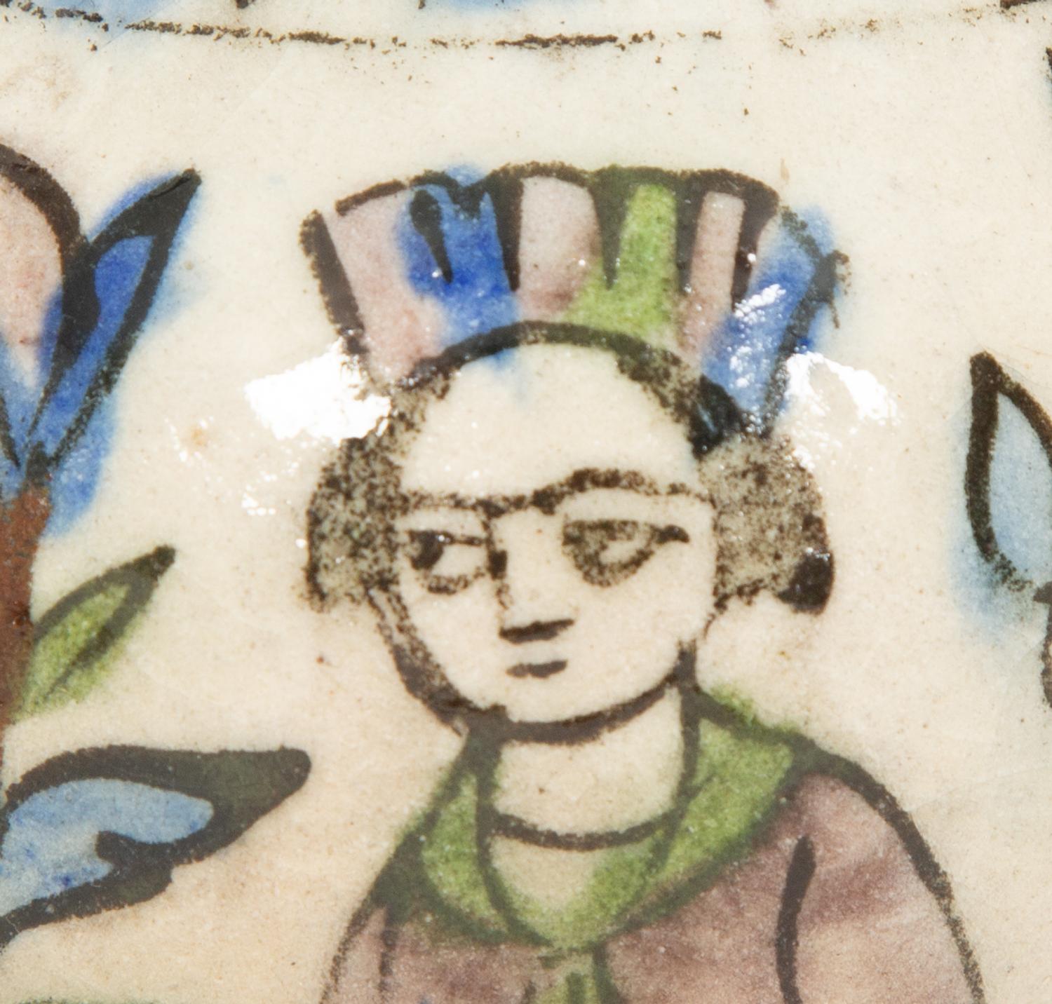 An Islamic Iznik Glazed Pottery Plate and a Small Vase
