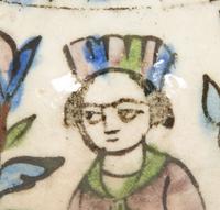 An Islamic Iznik Glazed Pottery Plate and a Small Vase