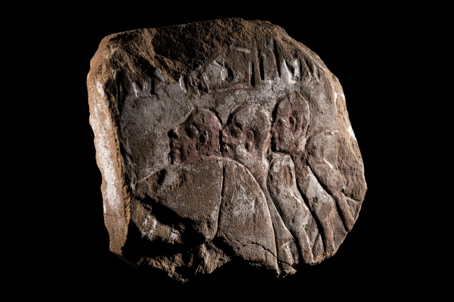 An Egyptian Painted Sandstone Relief Fragment