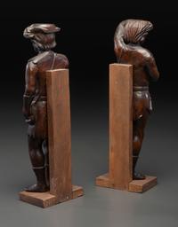 A Pair of Continental Carved Oak Huntsman Figures