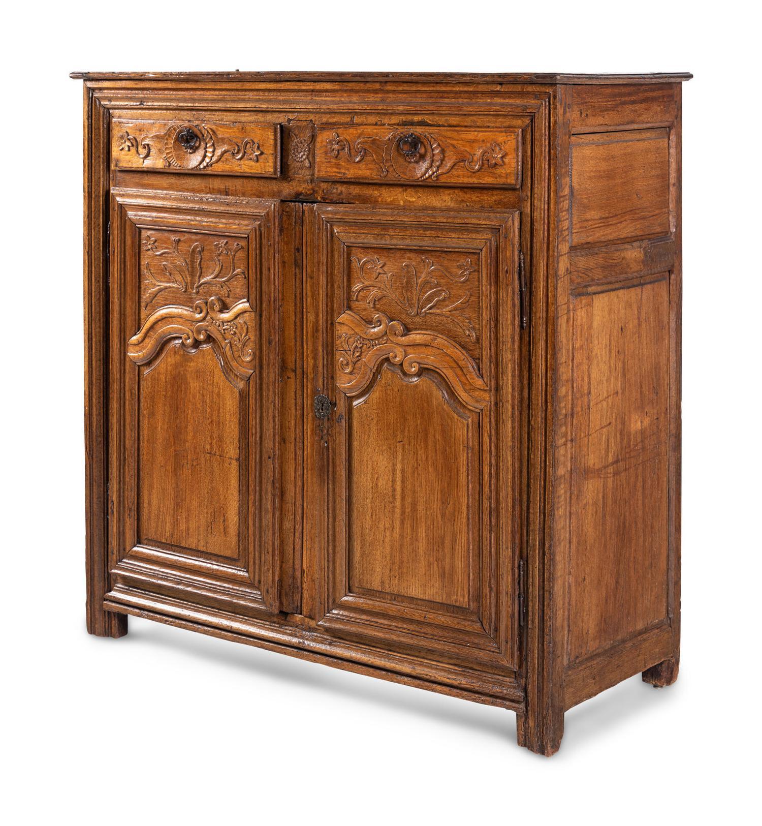 A French Provincial Carved Oak Cabinet