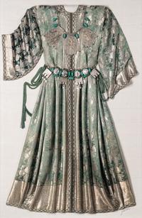 A Middle Eastern Metal and Stone-Embellished Dress in an Acrylic Frame