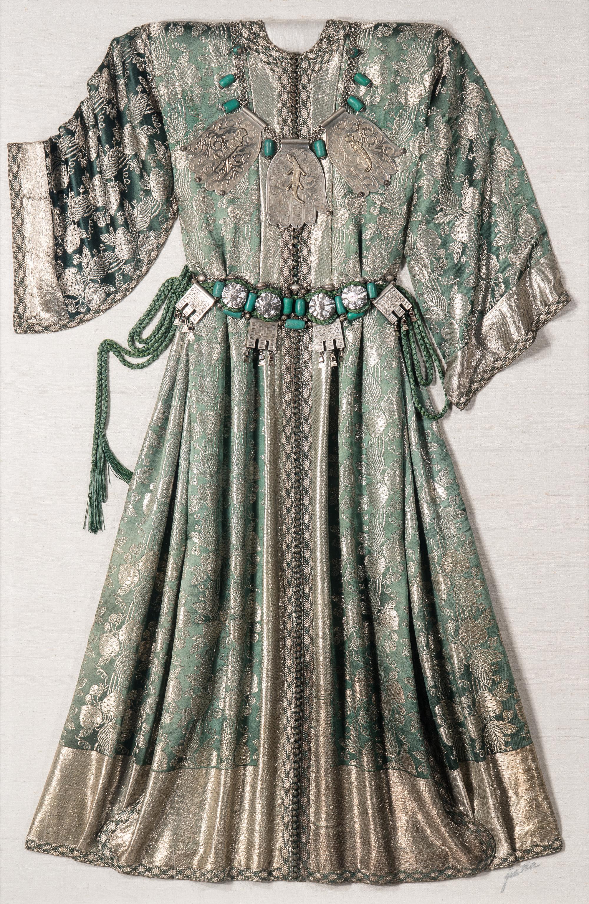 A Middle Eastern Metal and Stone-Embellished Dress in an Acrylic Frame