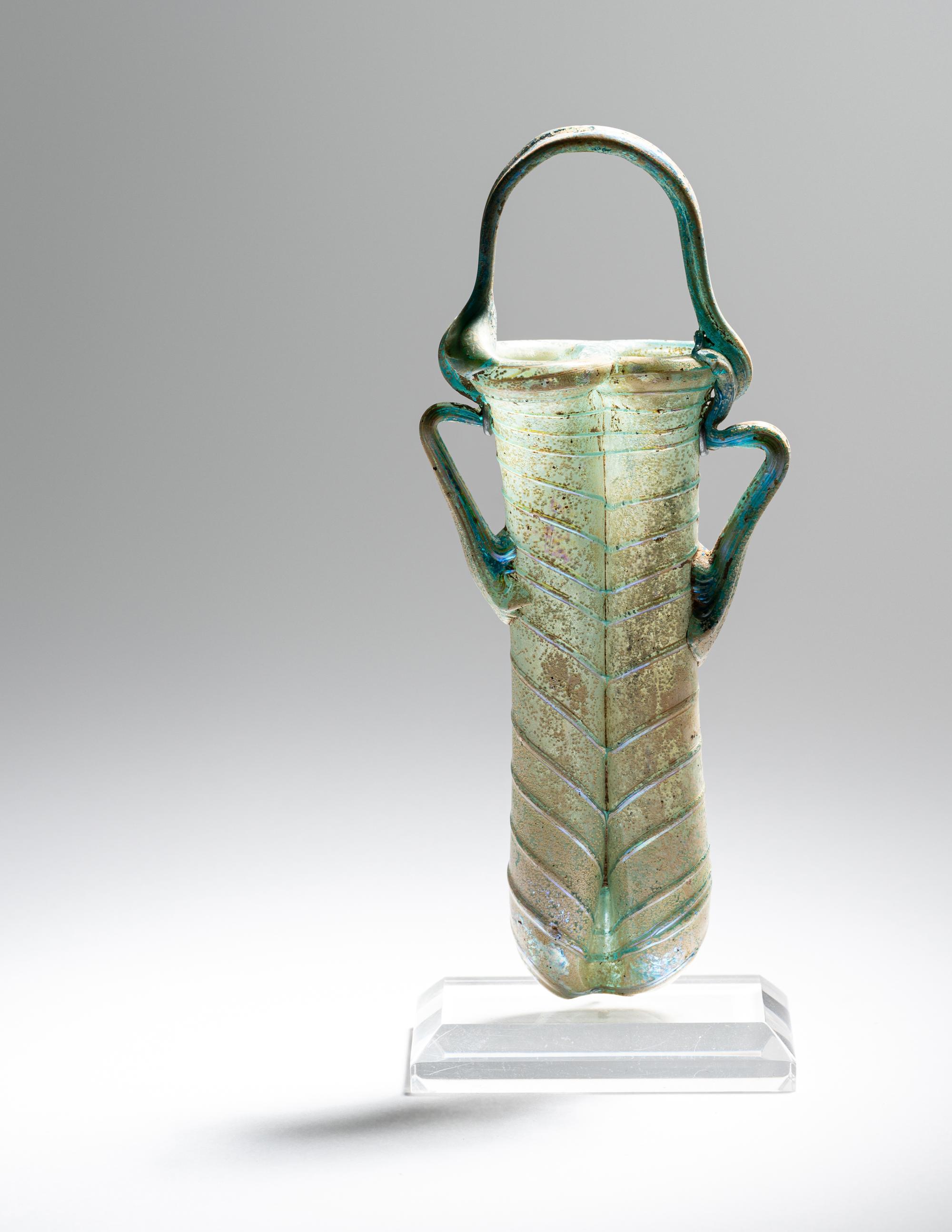 A Roman Green Glass Double Unguentarium
