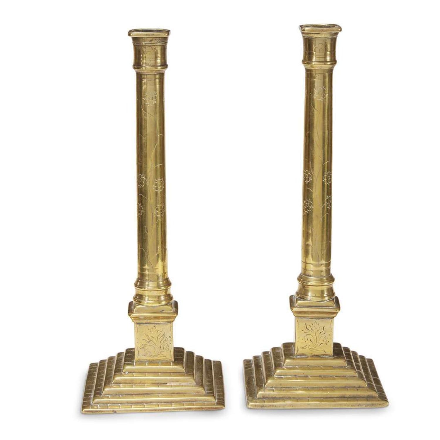 Pair of floral-etched brass candlesticks Continental, 18th century