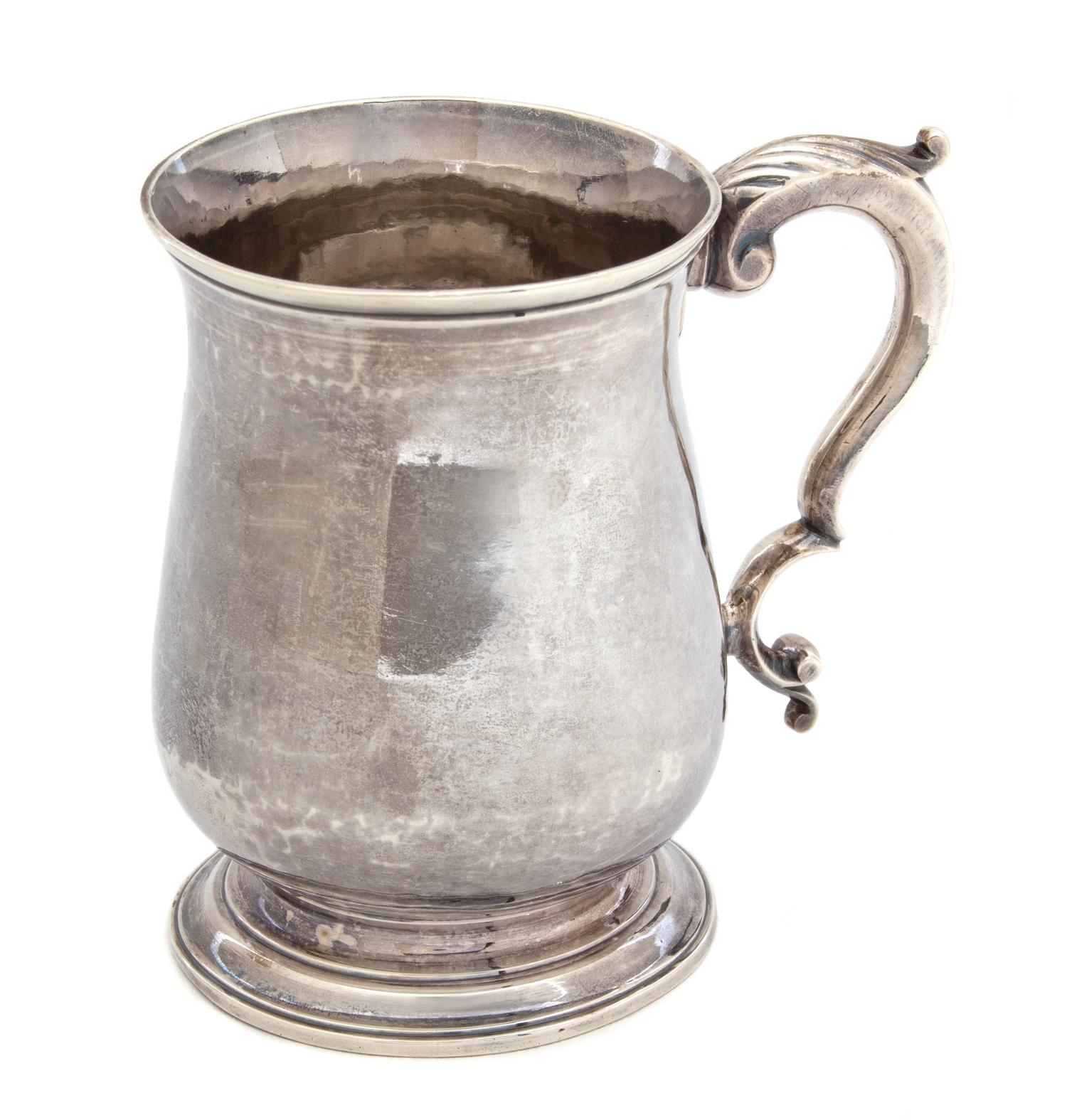 A George III Silver Cann, Thomas Wynne, London, 1771-72, of baluster form above a molded circular foot applied with a leaf-capped doubl