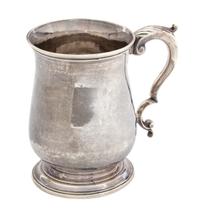A George III Silver Cann, Thomas Wynne, London, 1771-72, of baluster form above a molded circular foot applied with a leaf-capped doubl