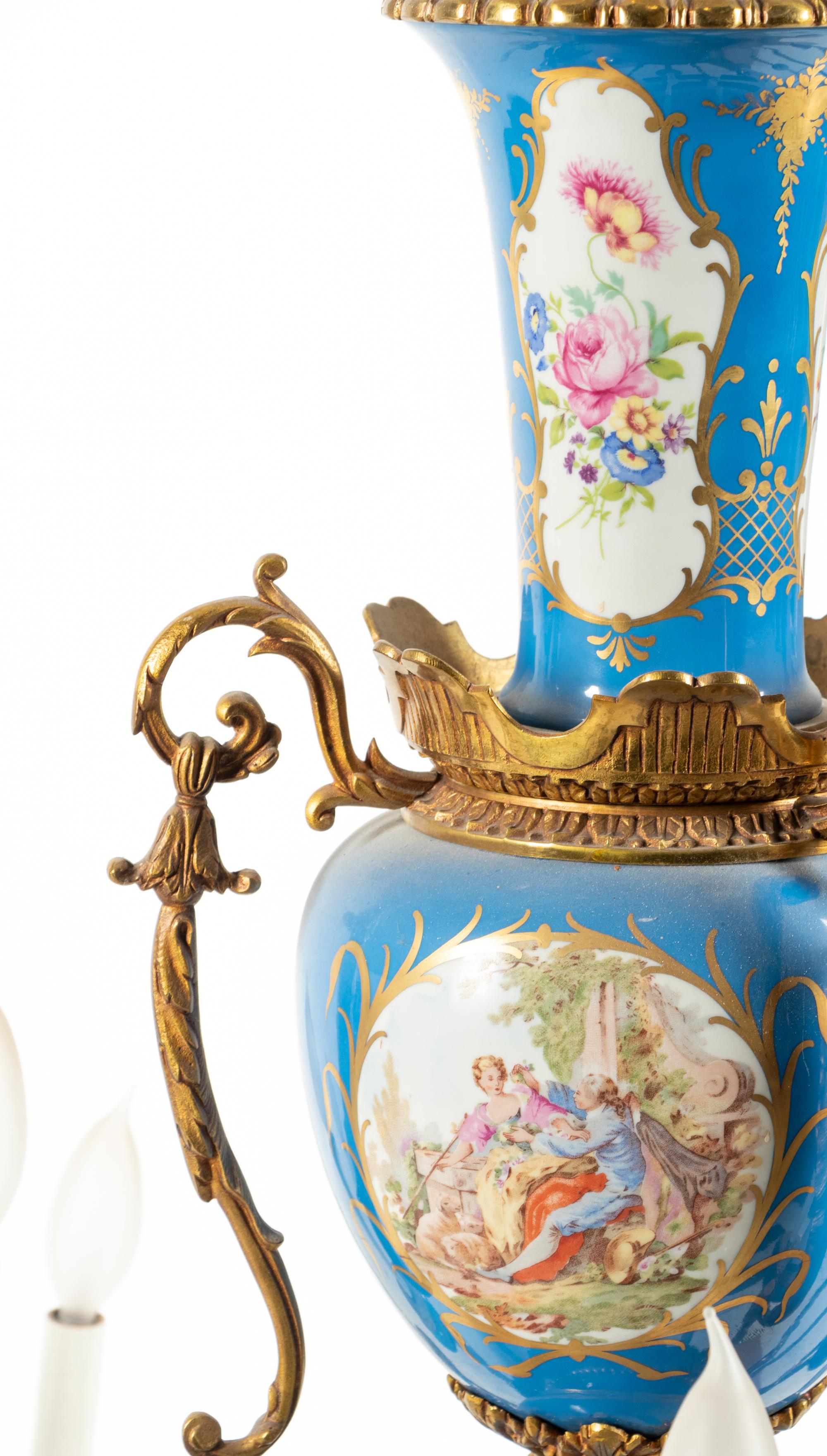 A Sèvres Style Painted Glass and Gilt Metal Mounted Eighteen-Light Chandelier