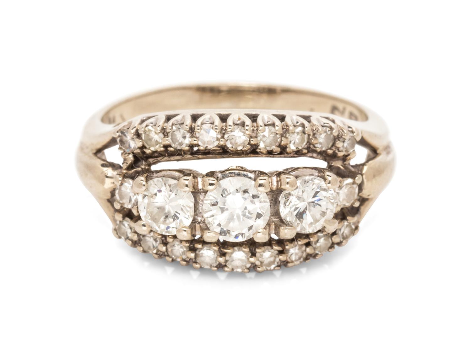 A 14 Karat White Gold and Diamond Ring,