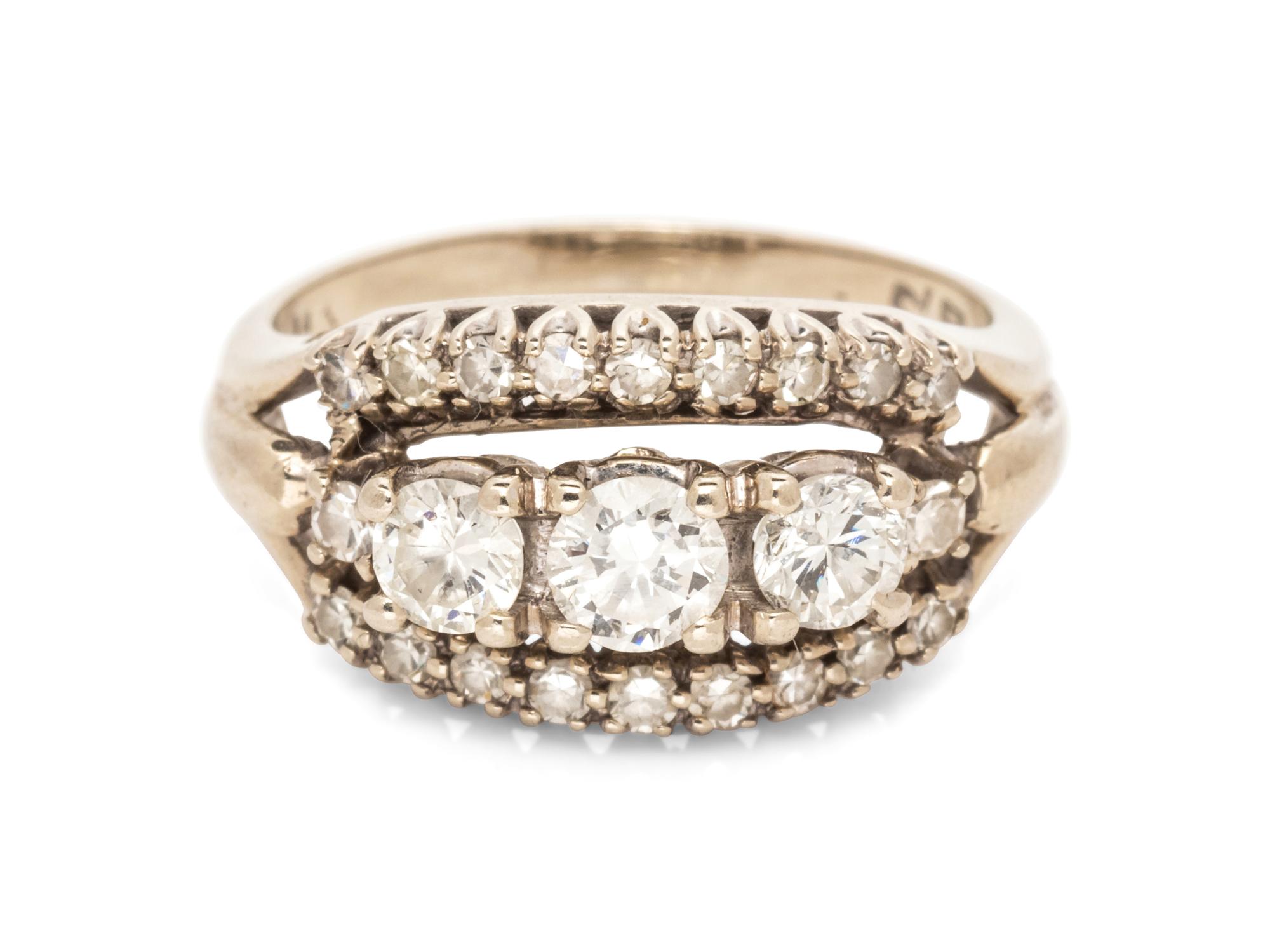 A 14 Karat White Gold and Diamond Ring,