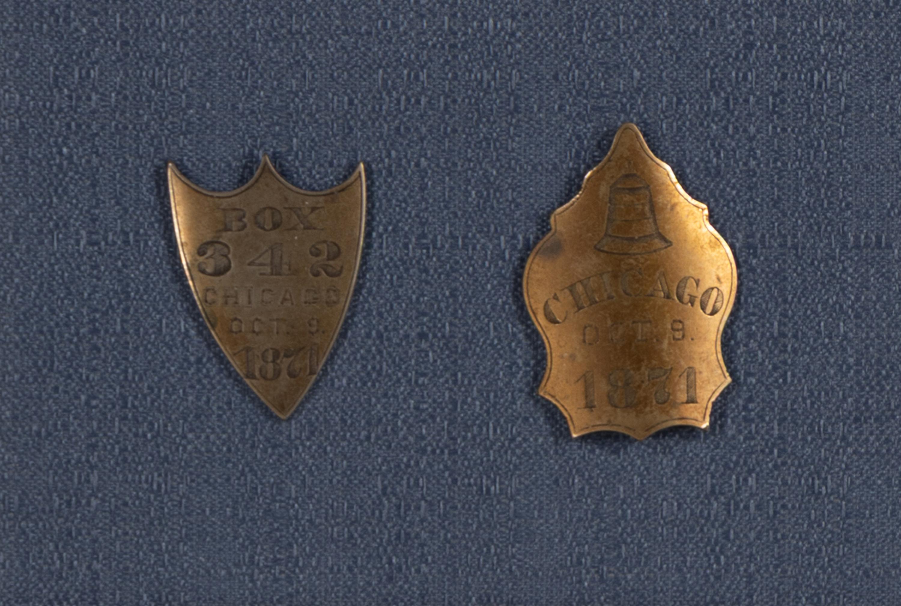 [Chicago Fire]. A pair of Chicago Fire bell badges, 1871.