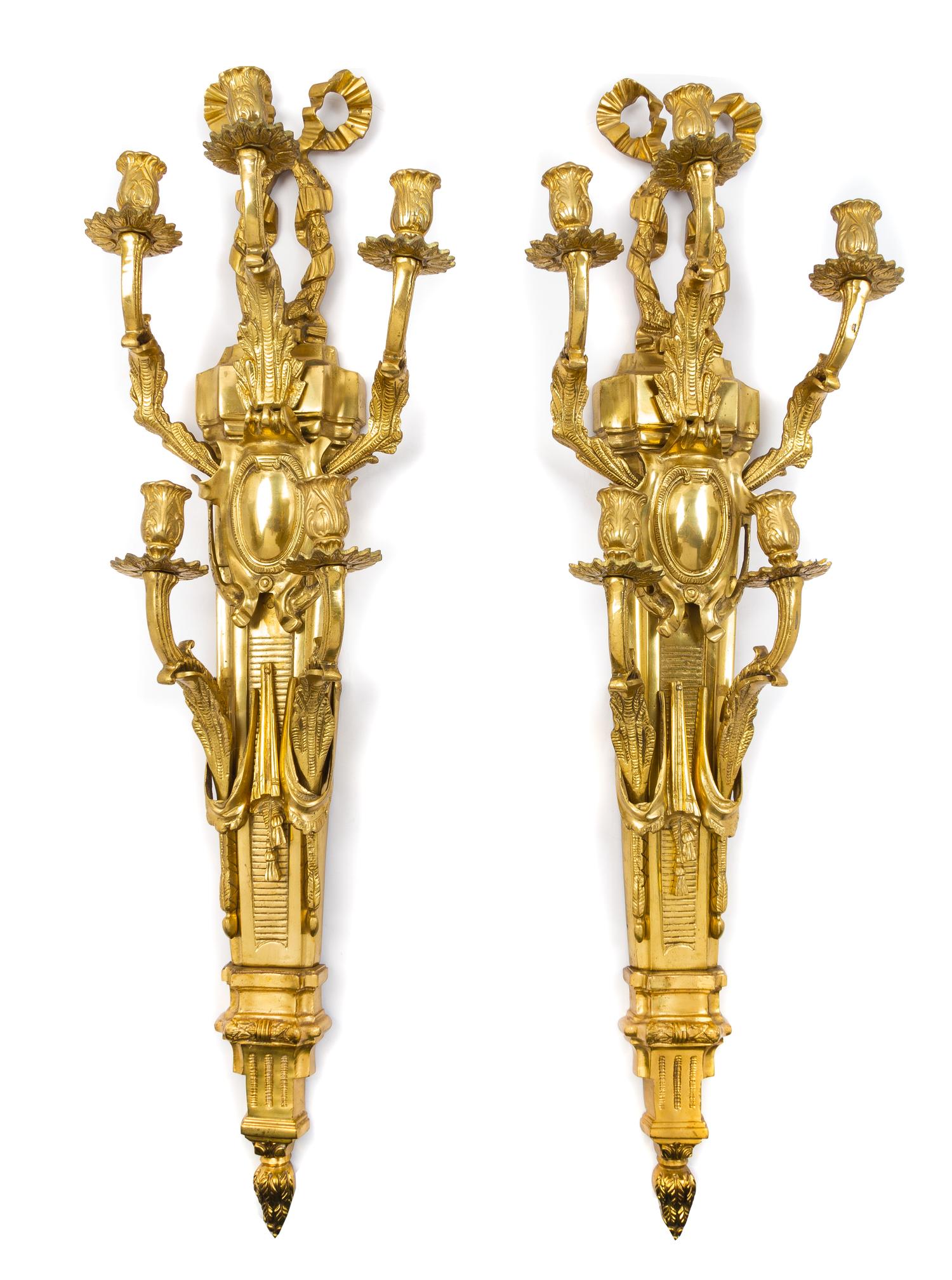 A Pair of Louis XVI Style Gilt Bronze Five-Light Sconces Height 38 1/2 inches. — LATE 20TH CENTURY