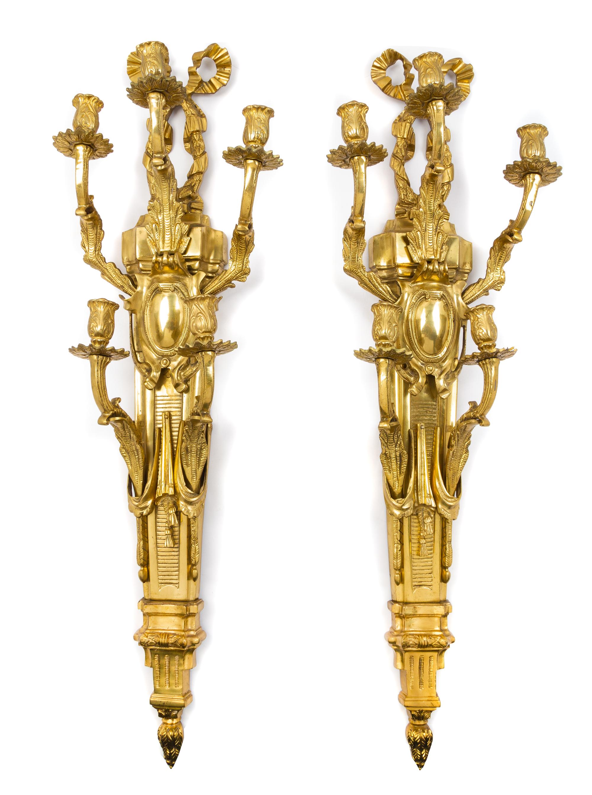 A Pair of Louis XVI Style Gilt Bronze Five-Light Sconces Height 38 1/2 inches. — LATE 20TH CENTURY