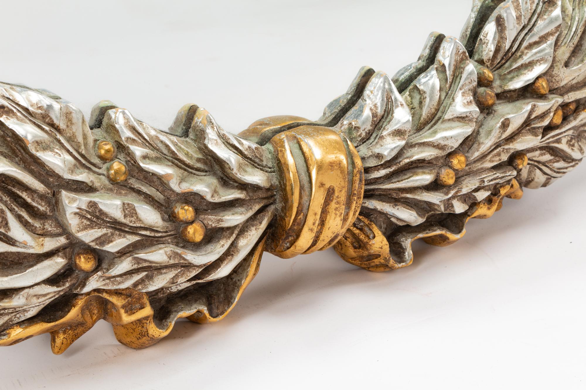 A Pair of Carved, Gilt and Silvered Wood Laurel Wreath Mirrors