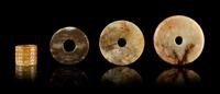Four Archaistic Jade Articles Diameter of largest 2 5/8 inches. — LATE QING/REPUBLIC PERIOD