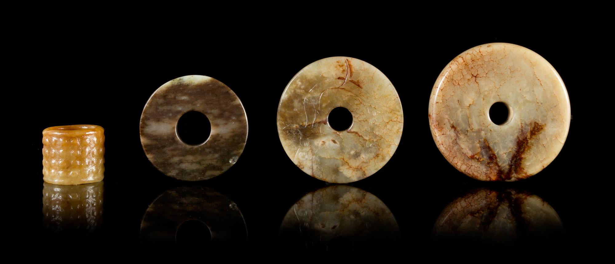 Four Archaistic Jade Articles Diameter of largest 2 5/8 inches. — LATE QING/REPUBLIC PERIOD