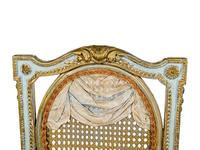 A Pair of Louis XVI Style Painted and Parcel-Gilt Chaises