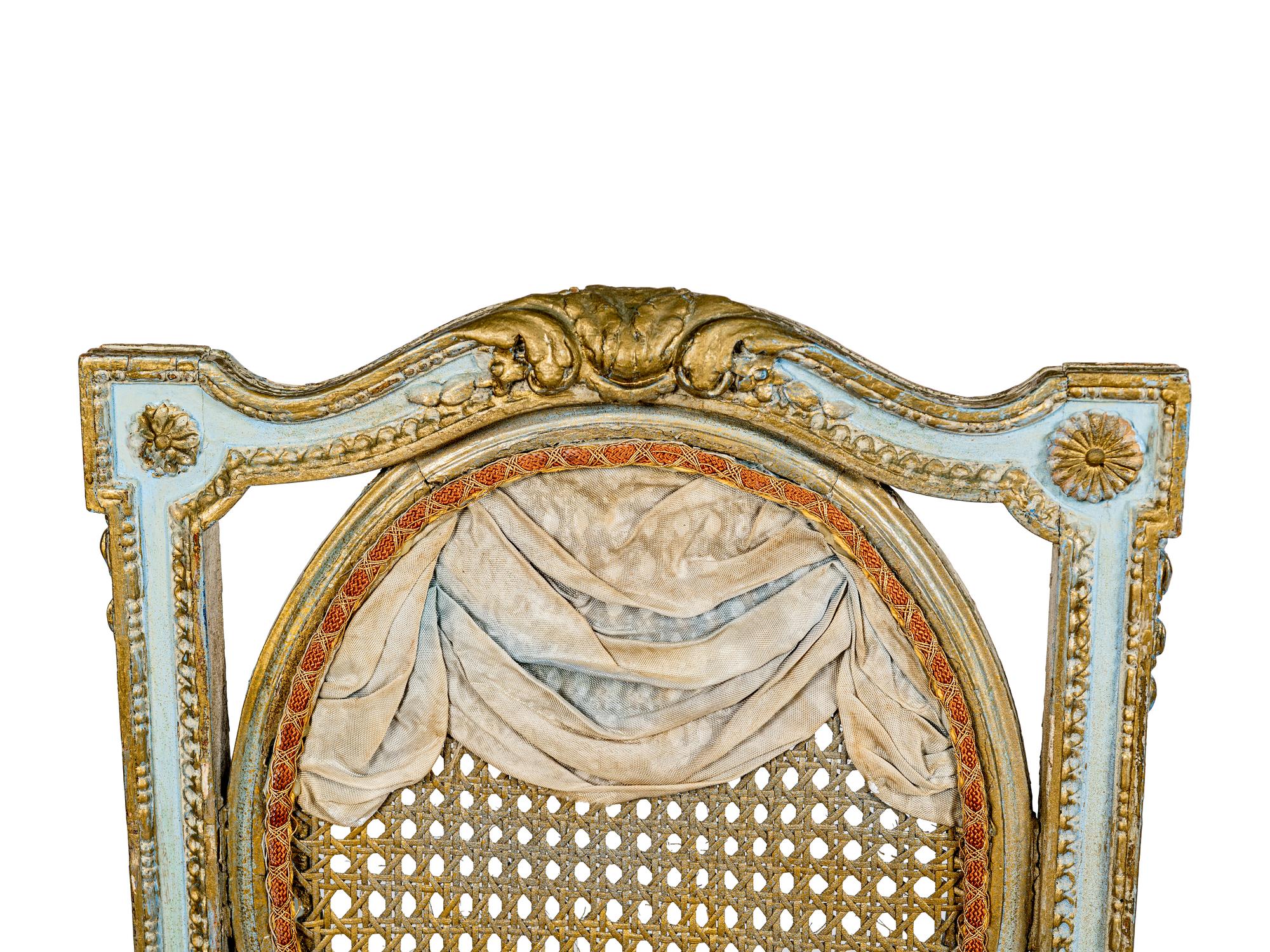 A Pair of Louis XVI Style Painted and Parcel-Gilt Chaises