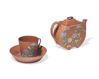 A Wedgwood Rosso Antico Teapot, Cup and Saucer