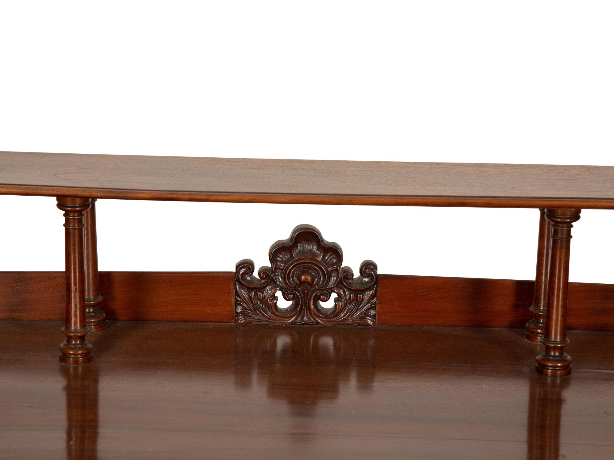 A Victorian Mahogany Lady's Writing Table with Shelf