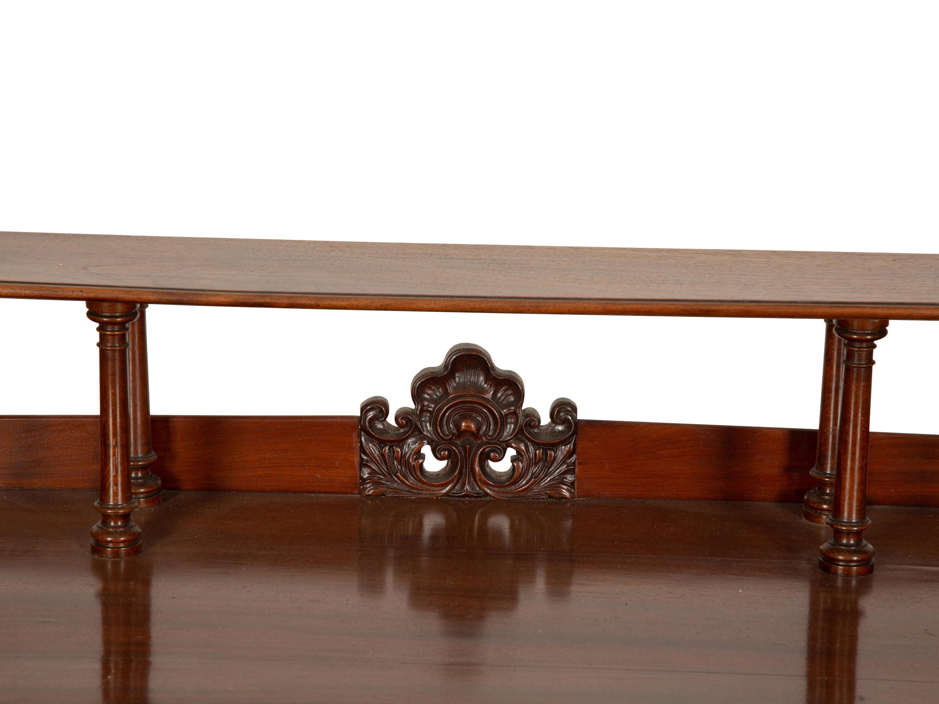 A Victorian Mahogany Lady's Writing Table with Shelf