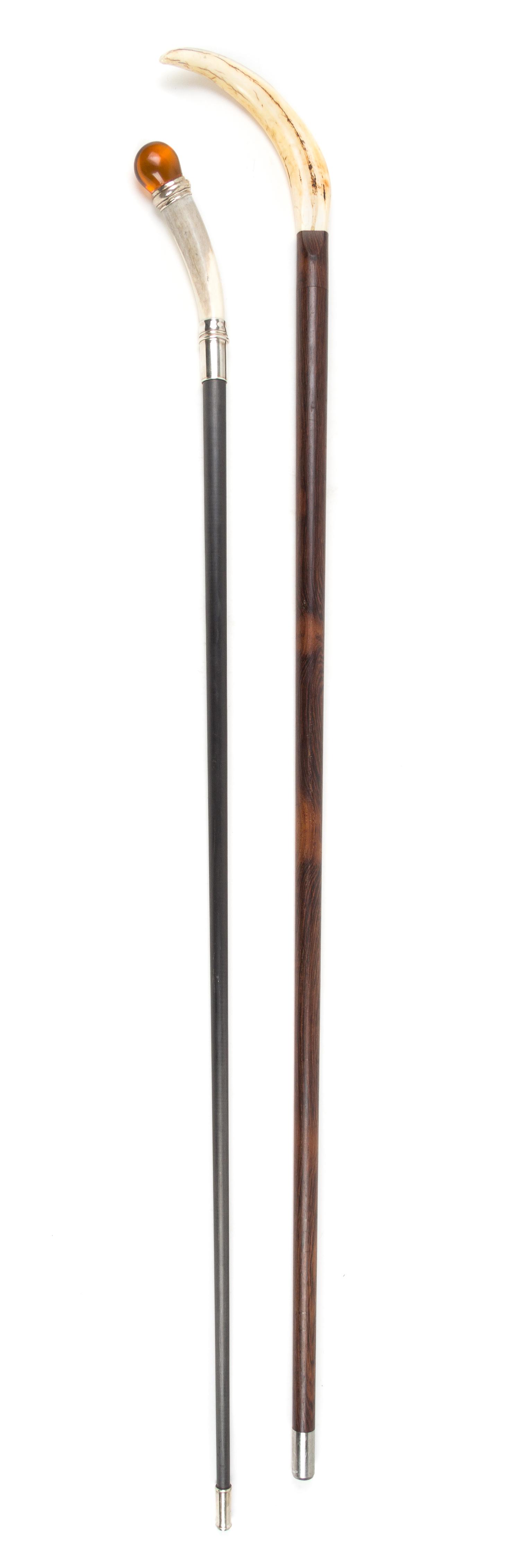 Two Continental Sword Canes Length of longer 35 3/4 inches.