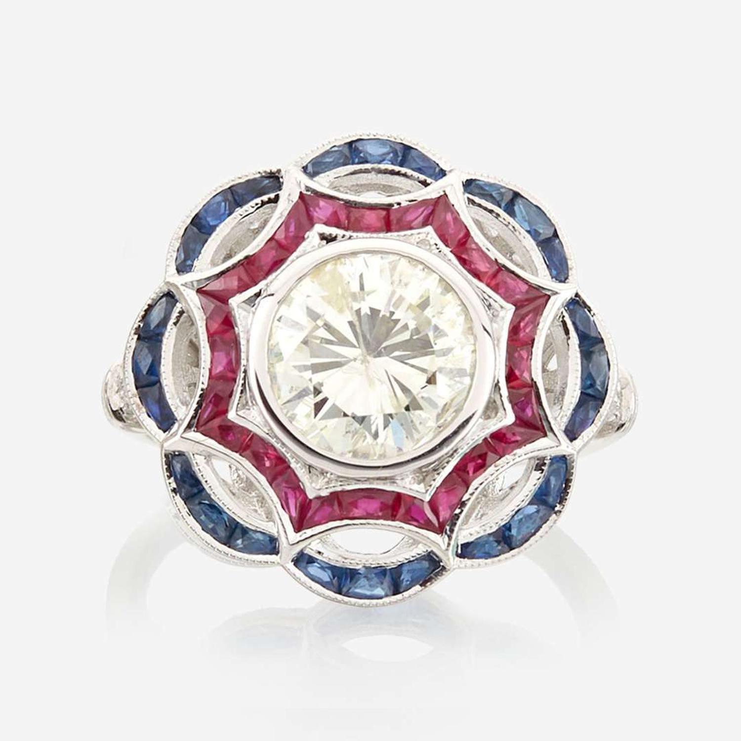 A diamond, ruby, sapphire, and white gold ring