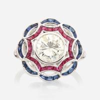 A diamond, ruby, sapphire, and white gold ring