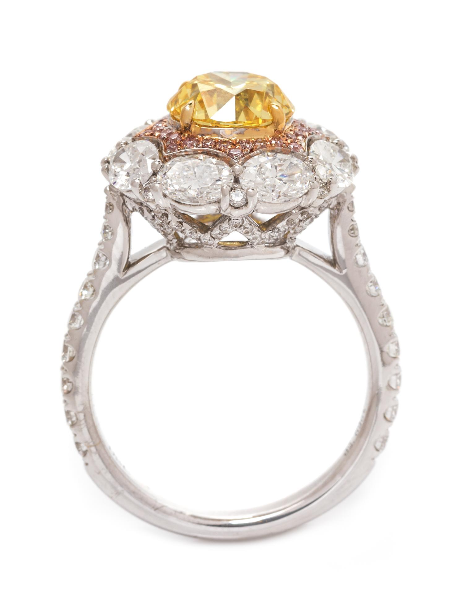 An 18 Karat Tricolor Gold, Fancy Vivid Yellow Diamond, Diamond and Colored Diamond Ring, 4.90 dwts.
