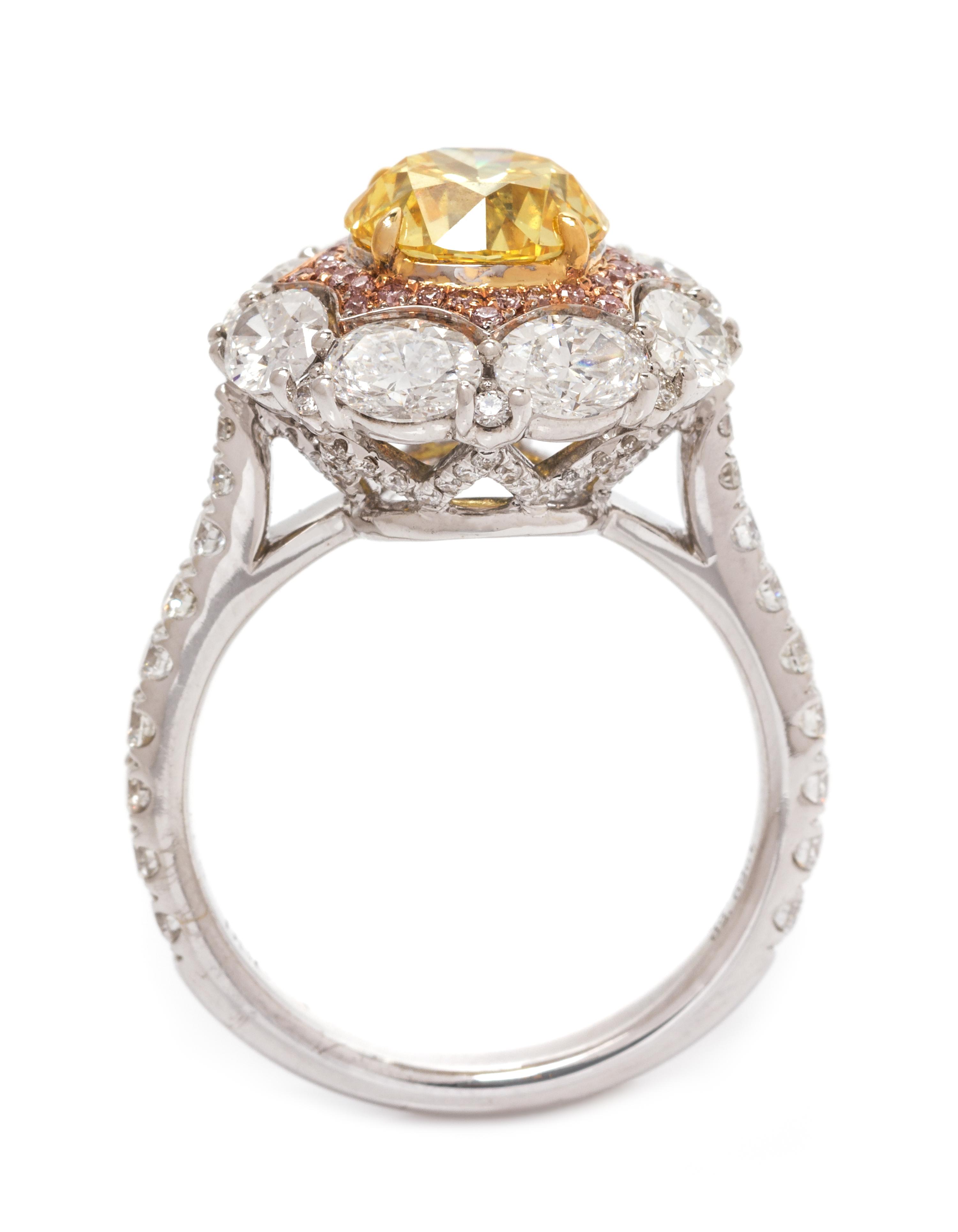 An 18 Karat Tricolor Gold, Fancy Vivid Yellow Diamond, Diamond and Colored Diamond Ring, 4.90 dwts.