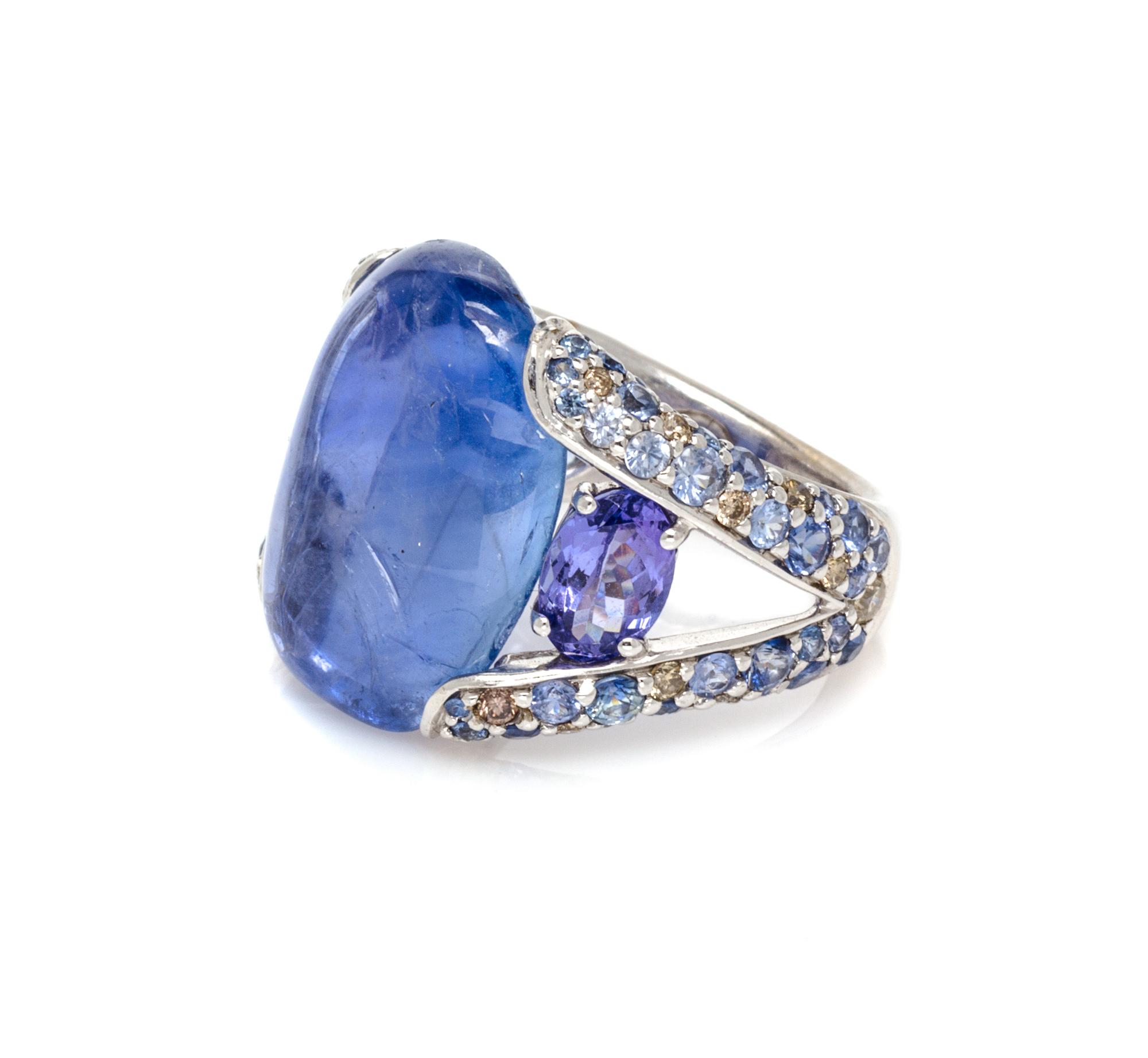 An 18 Karat White Gold, Sapphire, Tanzanite and Diamond Ring, 8.30 dwts.
