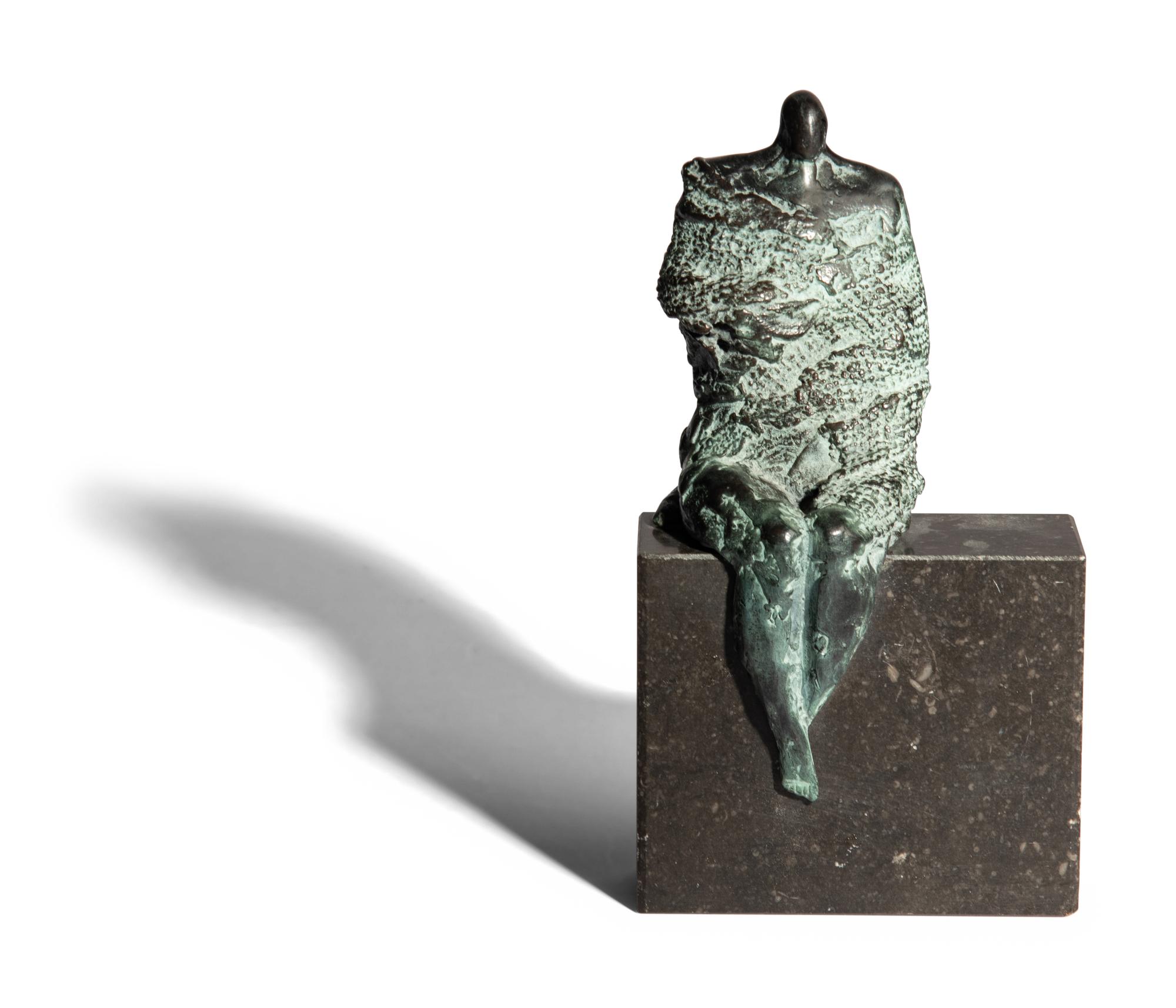 Sculpture, seated man