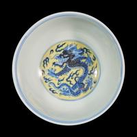 A Chinese Yellow Ground Blue and White Porcelain ‘Dragon’ Bowl, Kangxi Mark — 康熙款 黃地青花龍紋盌