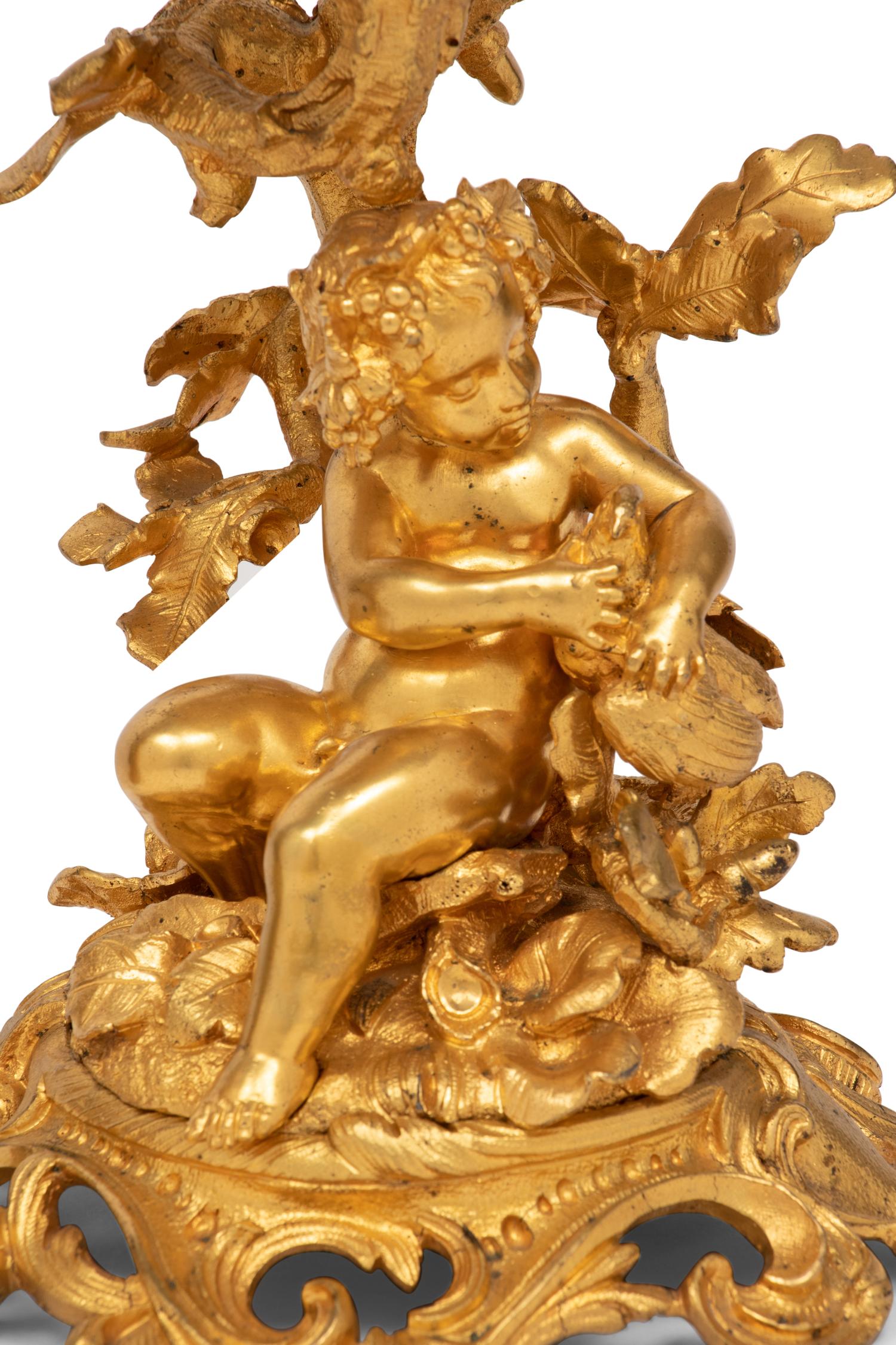 A Pair of French Gilt Bronze and Glass Three-Tier Stands