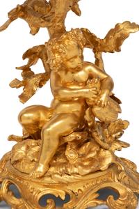 A Pair of French Gilt Bronze and Glass Three-Tier Stands